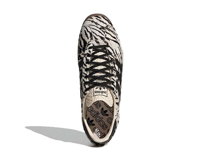 Scarpe da ginnastica femminili in stile vintage con fantasia zebrata.