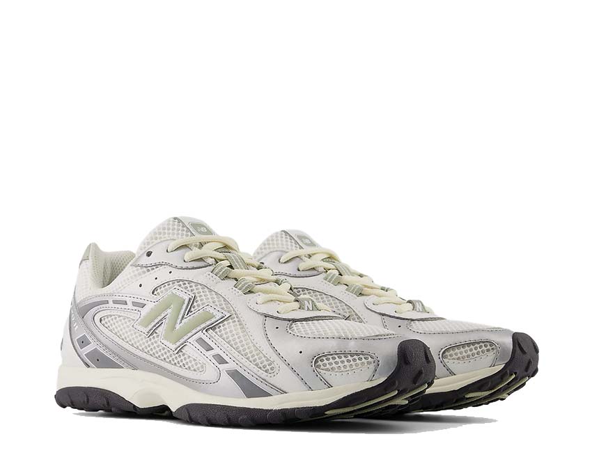 Scarpe sportive in pelle e tessuto con motivo serpente.