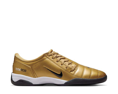 Calzature sportive in pelle sintetica color oro metallizzato.