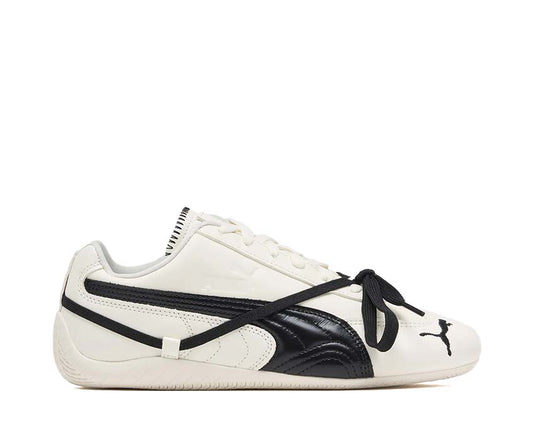 Scarpe da ginnastica in pelle bianca con design sofisticato e dettagli curati.